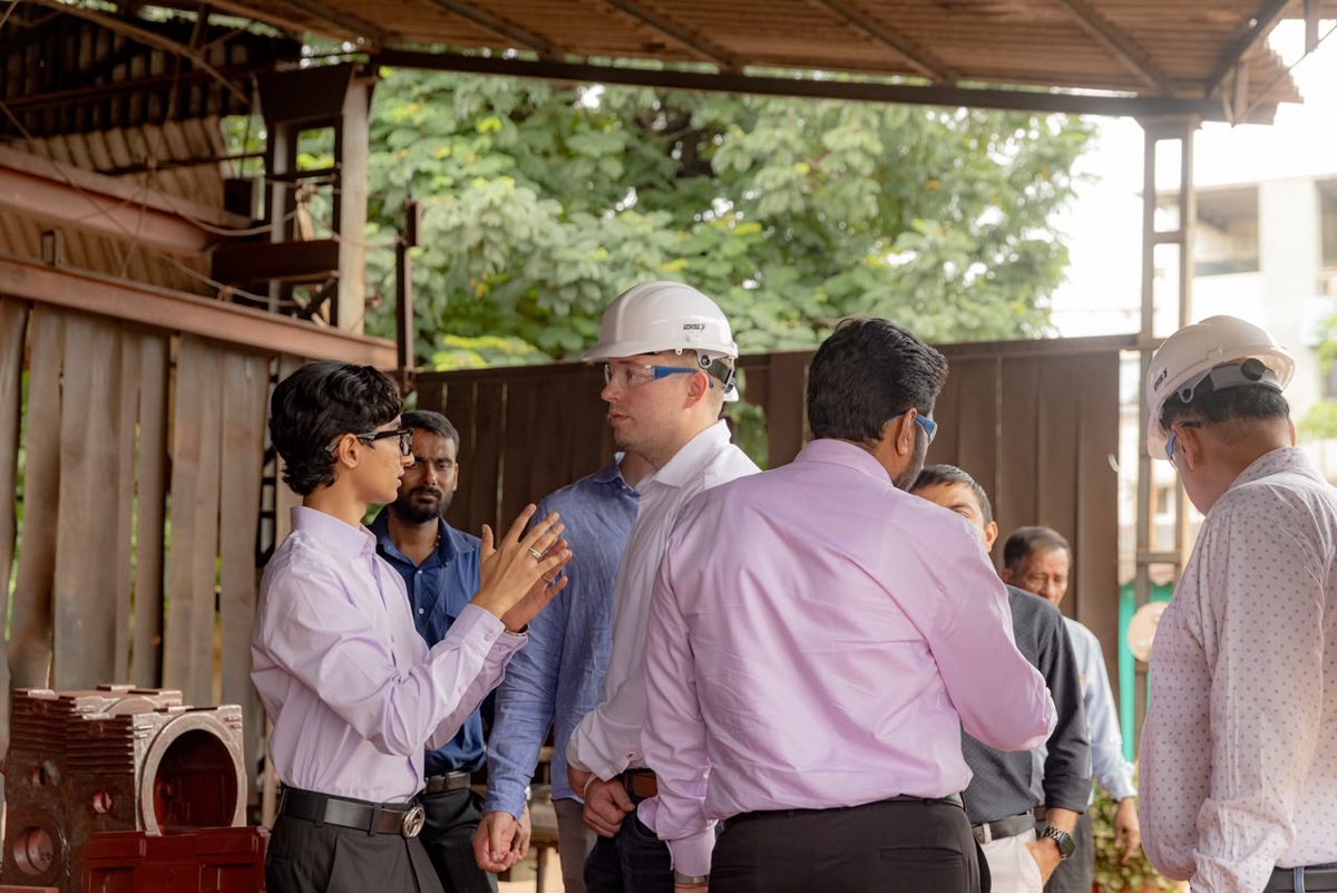 Swayam J. Shah explaining castings to an international client during a Fine Cast foundry walkthrough in Anand