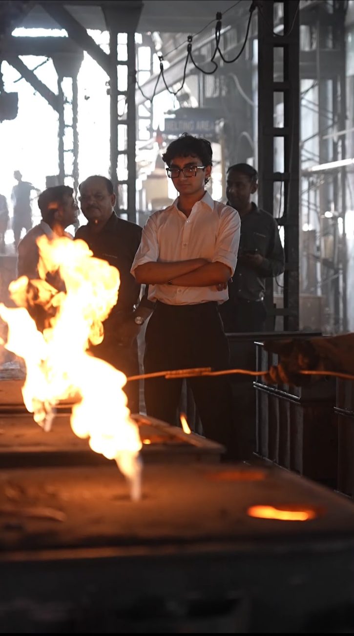 Swayam J. Shah at the melting area of the Fine Cast iron foundry in Anand Gujarat watching molten metal poured